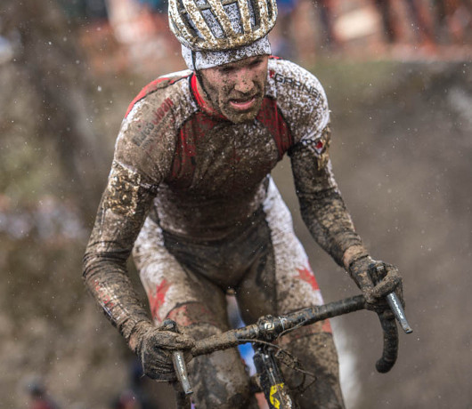 National champion Geoff Kabush powering through the mud and snow in the elite men's world championship race. He was the top Canadian, finishing 24th.