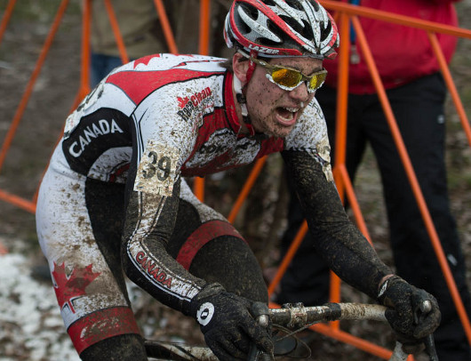Andrew l'Esperance faces the muddy world championship course in Louisville, Ky., during the under-23 men's race.