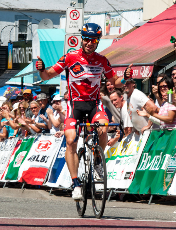 Canadian road champion uses his Fonz-like salute as he wins the Tour de White Rock's Peace Arch News Road Race. Photo credit: Scott Robarts