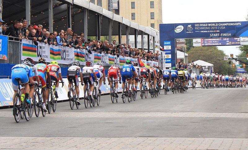 The field races across the start/finish line in the U-23 race at the UCI Road Cycling World Championships in Richmond.