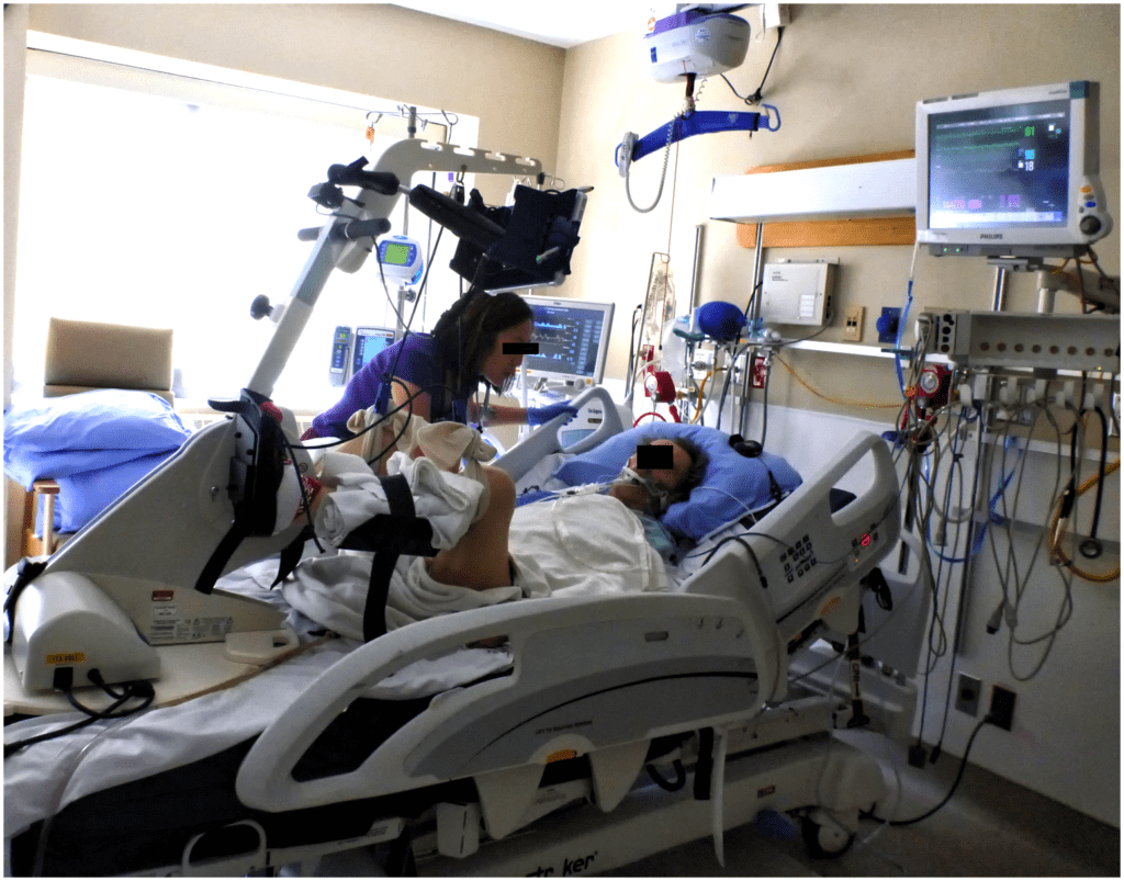 A patient receiving ventilation pedals in bed while under intensive care. (Source, shared under a Creative Commons License)