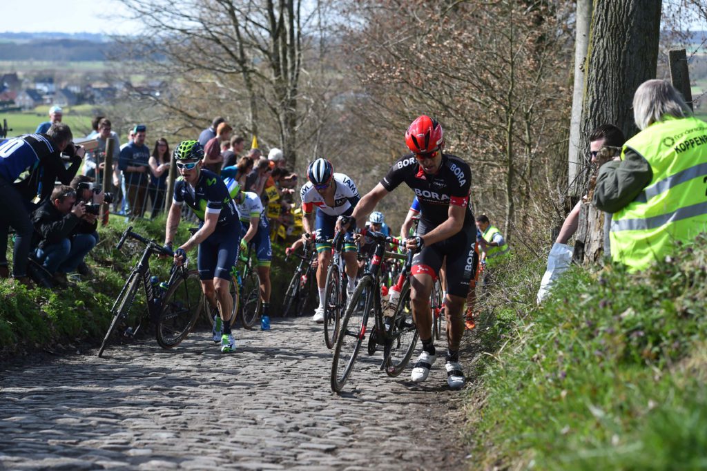  Rider walk their bikes up the steep slopes of the Koppenberg at the 2017 Tour of Flanders