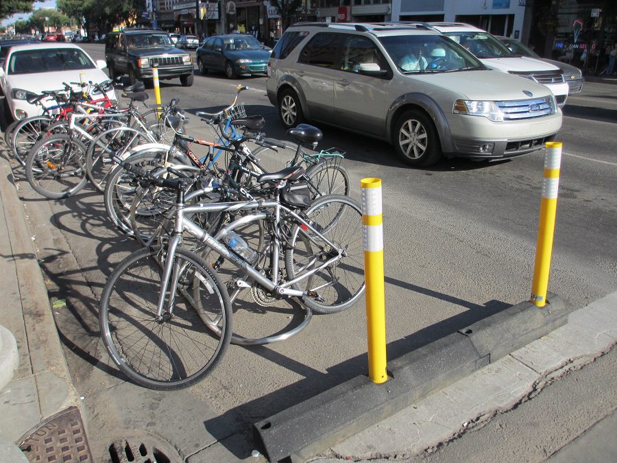 With overcrowded bike racks like these all over Edmonton, one solution, Thibaudeau says, is to introduce more to improve city cycling. (Photo Credit: mastermaq via Compfight )