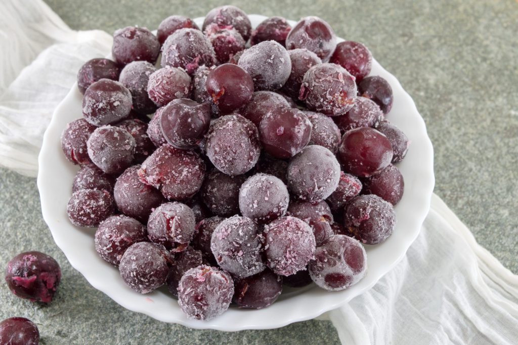 Frozen grapes served in a white bowl