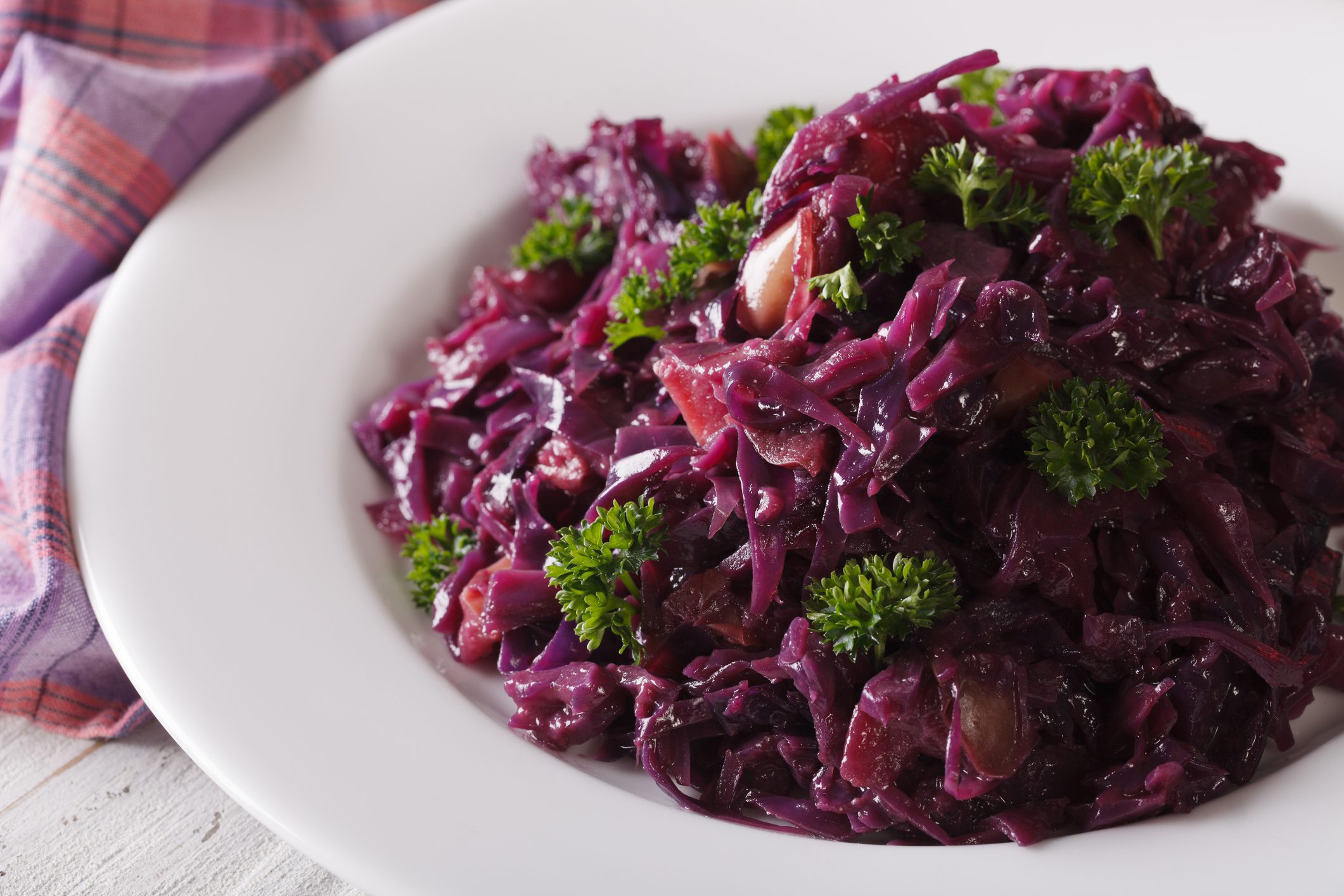 Delicious braised red cabbage close-up on a plate. horizontal