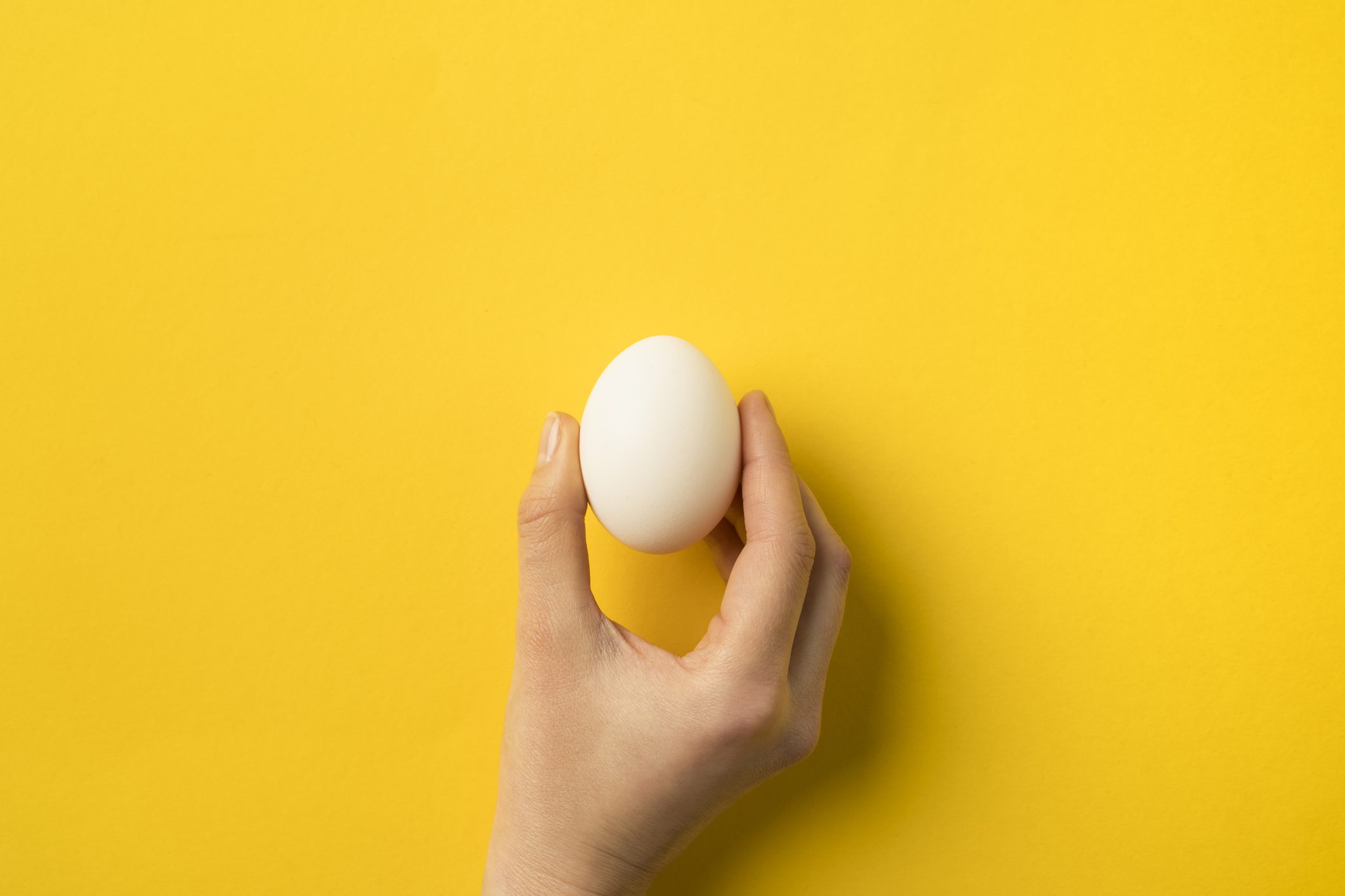 woman holding egg