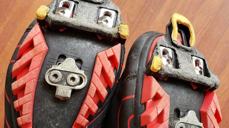 A pair of worn out cycling shoes