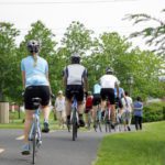 Brossard, QC, Canada - June 1, 2013: Pedestrians and bikers sharing the municipal bikepath on a beautiful summerday