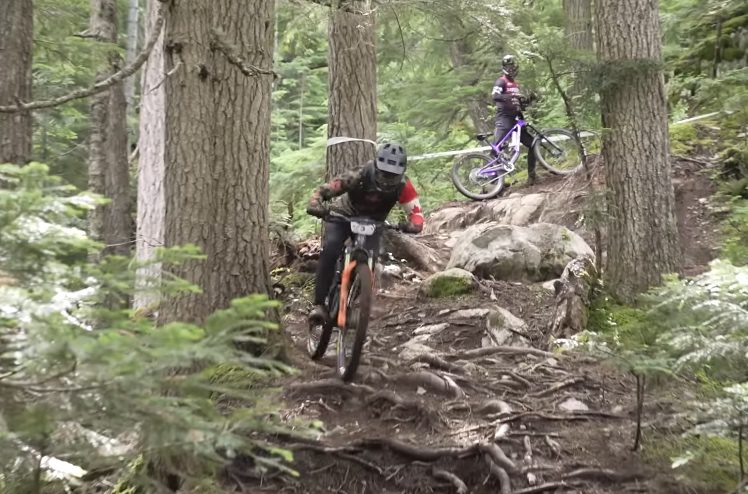 Jesse Melamed rides down a field of roots and rocks in Whistler