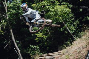 Finn Iles scrubs a jump during Mont-Sainte-Anne downhill World Cup