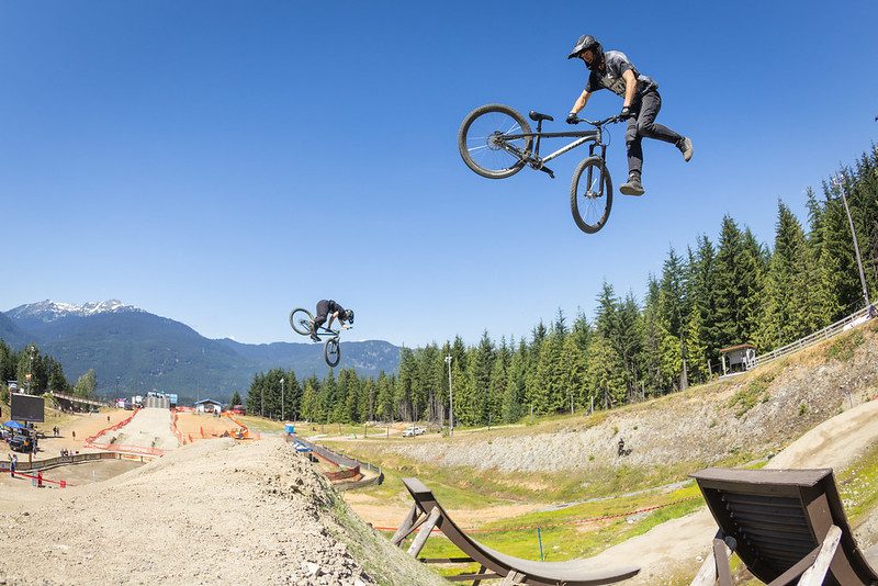 Two riders jump on the same course during Crankworx Whistler Dual Speed and Style