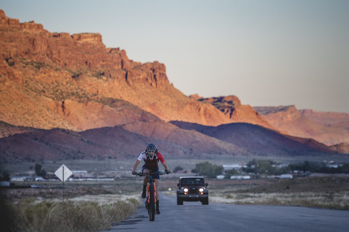Hannah Otto climbs into the sunrise during The Whole Enchilada FKT ride