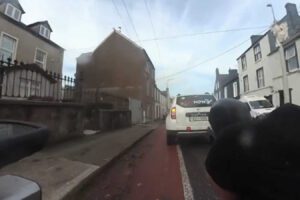 cab and cyclist in Cork Ireland