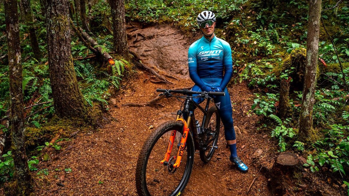 Carter Woods sits on his Giant Factory Off-Road Team bike