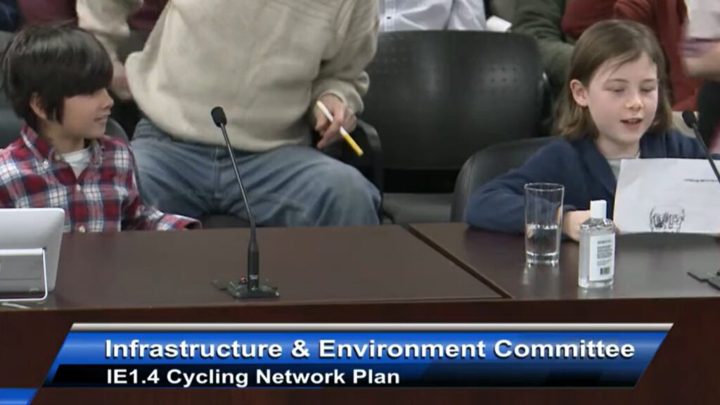 Two kids read to Toronto City Council about bike lanes