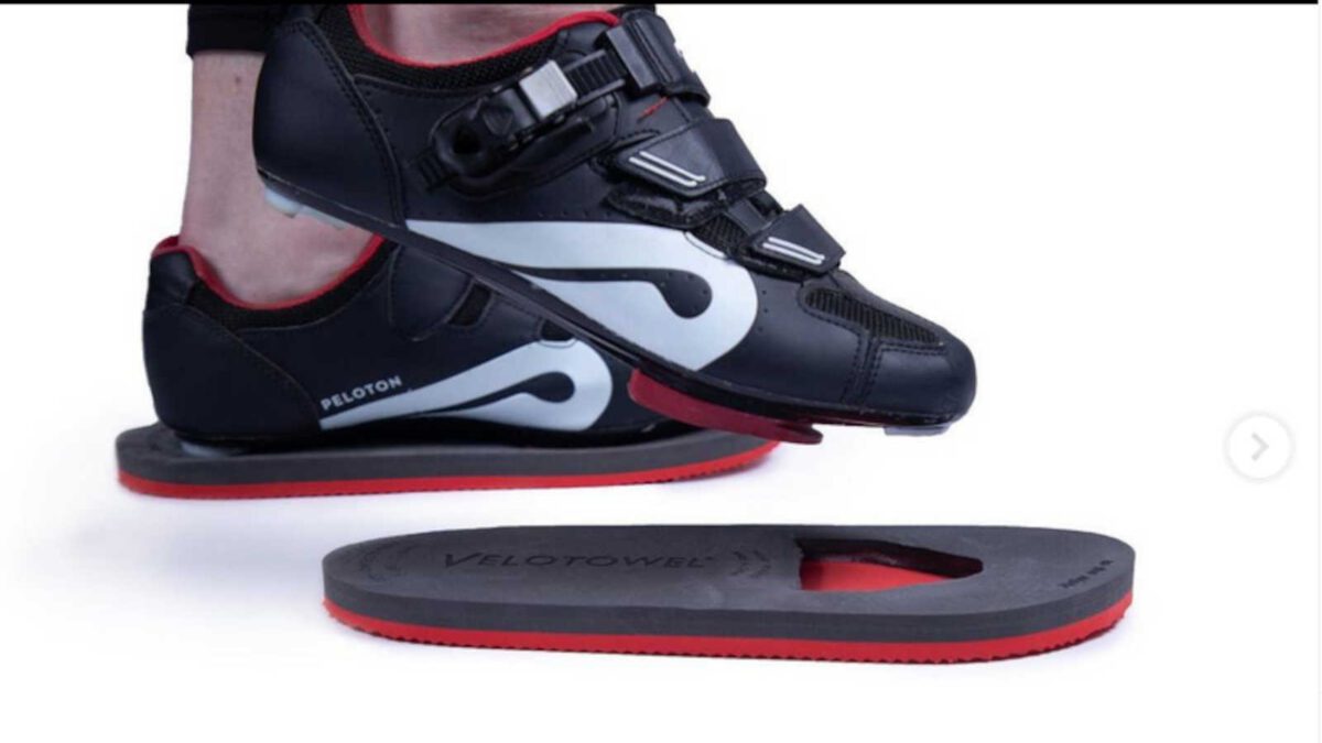 A cycling shoe going into a sandal