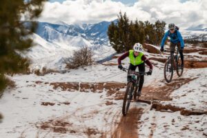 Racers ride snowy Utah trails during Moab Rocks
