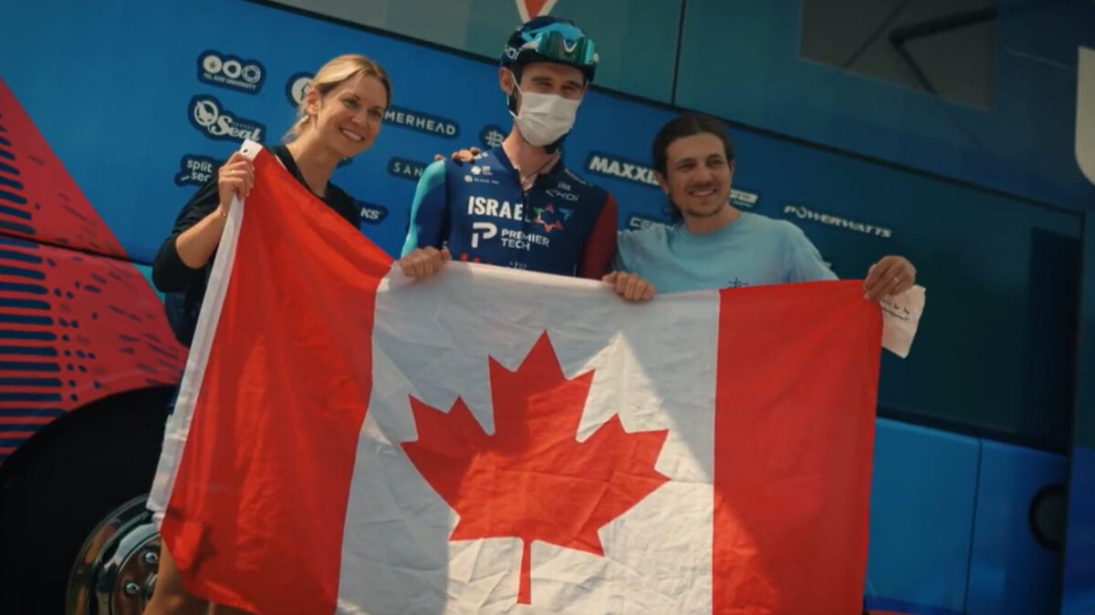 Derek Gee holding a Canadian flag