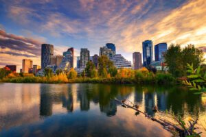 Sunset above city skyline of Calgary with Bow River, Canada