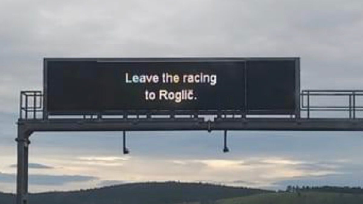 A sign on a Slovenian Highway which says leave the racing to Roglic