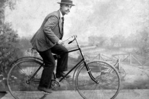 Vintage image of man riding bicycle