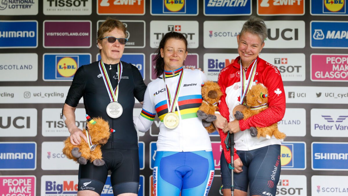 Picture by Ed Sykes/SWpix.com - 11/08/2023 - Road Cycling - 2023 UCI Cycling World Championships - Dumfries & Galloway, Scotland - Women’s T2 Road Race Podium - Shelley Gautier of Canada in Bronze, Eltje Malzbender of New Zealand in Silver and Pavlina Vejvodova of Czech Republic in The Rainbow Jersey