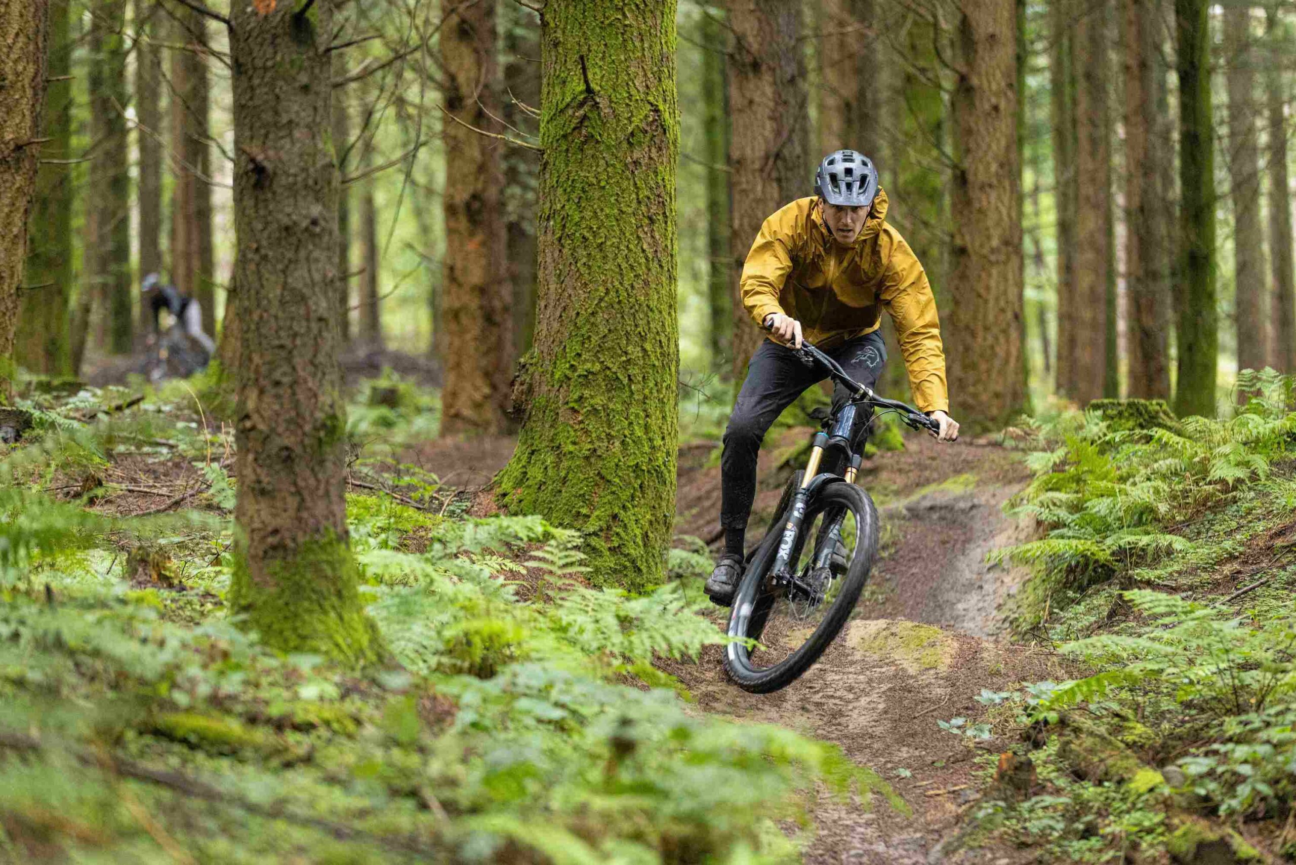 Riding in the Rab Cinder Downpour jacket before a downpour on the YT Jeffsey launch 