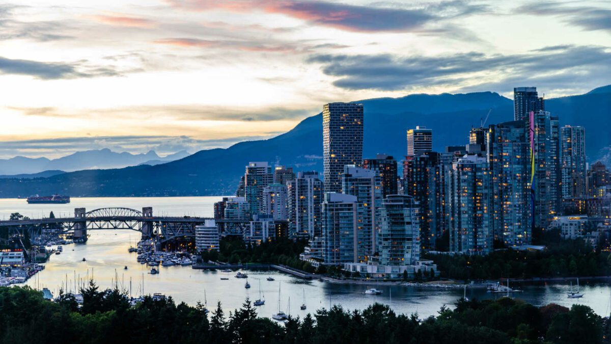 Vancouver Downtown, Burrard Bridge, False Creek, Burrard Inlet with Cypress and Grouse Mountains in the background during blue hour