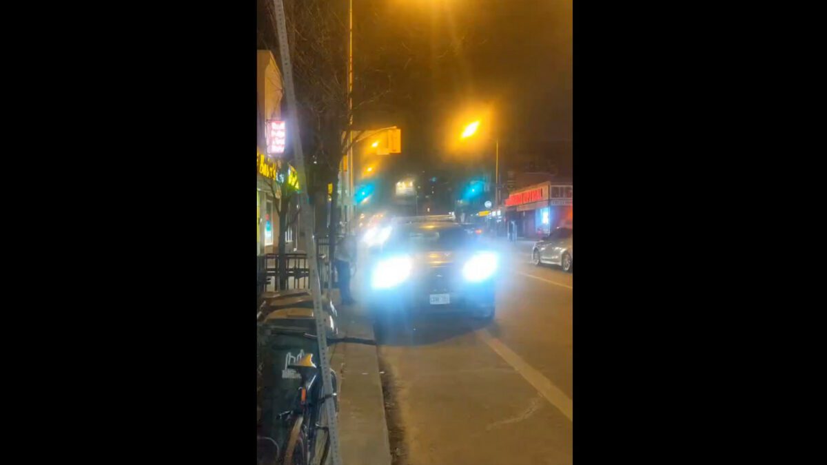 Toronto police officer parked in the bike lane
